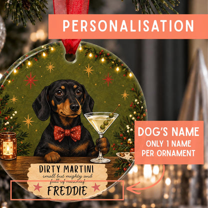 Personalized Christmas ornament featuring a dachshund holding a martini glass on an olive-green holiday background, with text overlays showing customization fields for the dog's name and holiday message.
