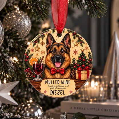 A personalized round Christmas ornament hanging on a decorated Christmas tree. The ornament features a German Shepherd dog wearing a red bow tie, surrounded by festive illustrations of mulled wine, pine trees, ornaments, and gifts.