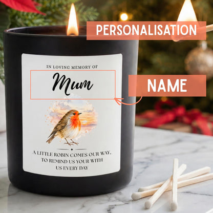 Personalisation guide for a robin remembrance candle in a matt black glass jar, showing the customisable Mum name highlighted above a watercolour robin illustration and heartfelt memorial verse.