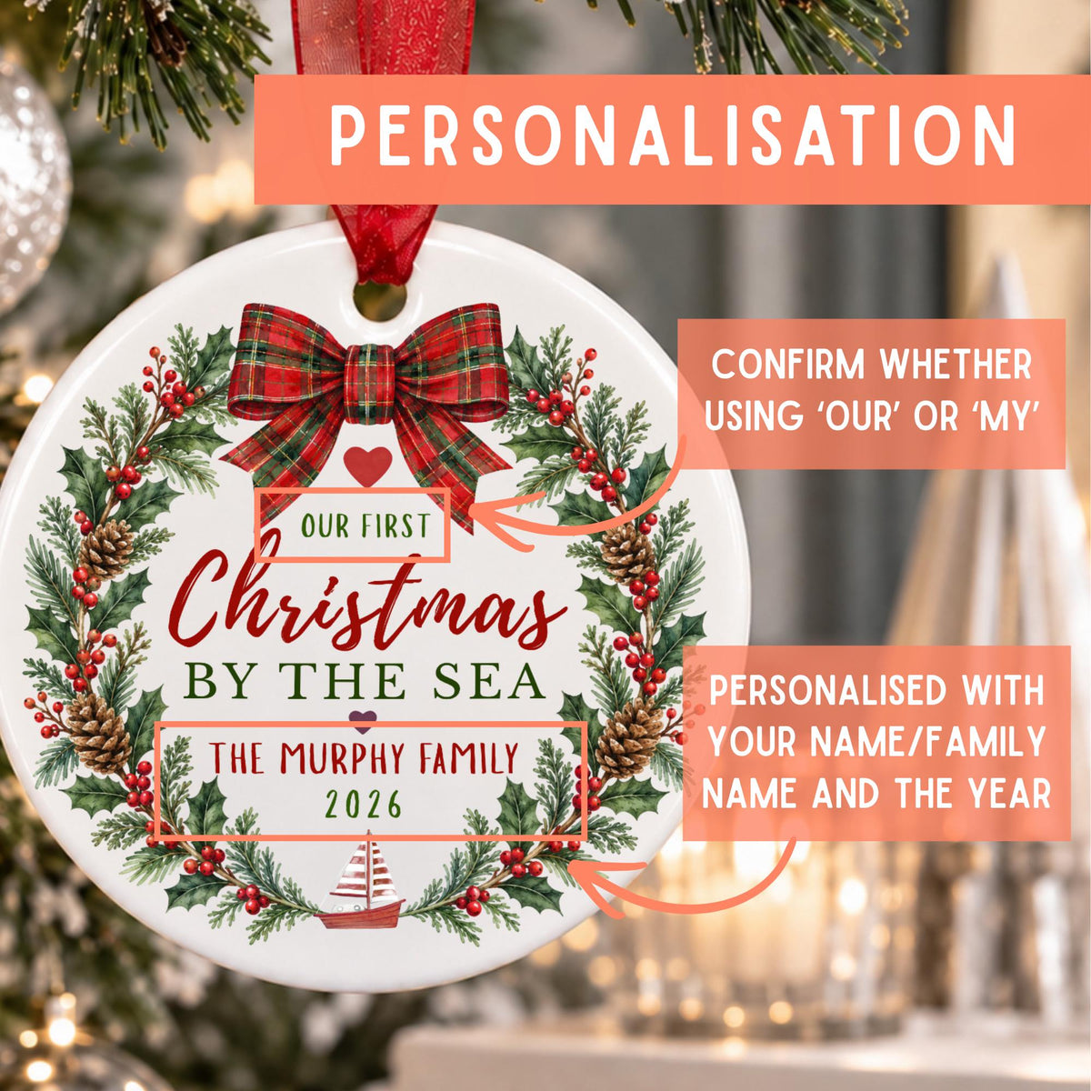Personalized round Christmas ornament with a wreath design, red bow, and text reading 'Our First Christmas by the Sea' and 'The Murphy Family 2026,' shown hanging in front of a blurred Christmas tree with informational callouts about personalization.