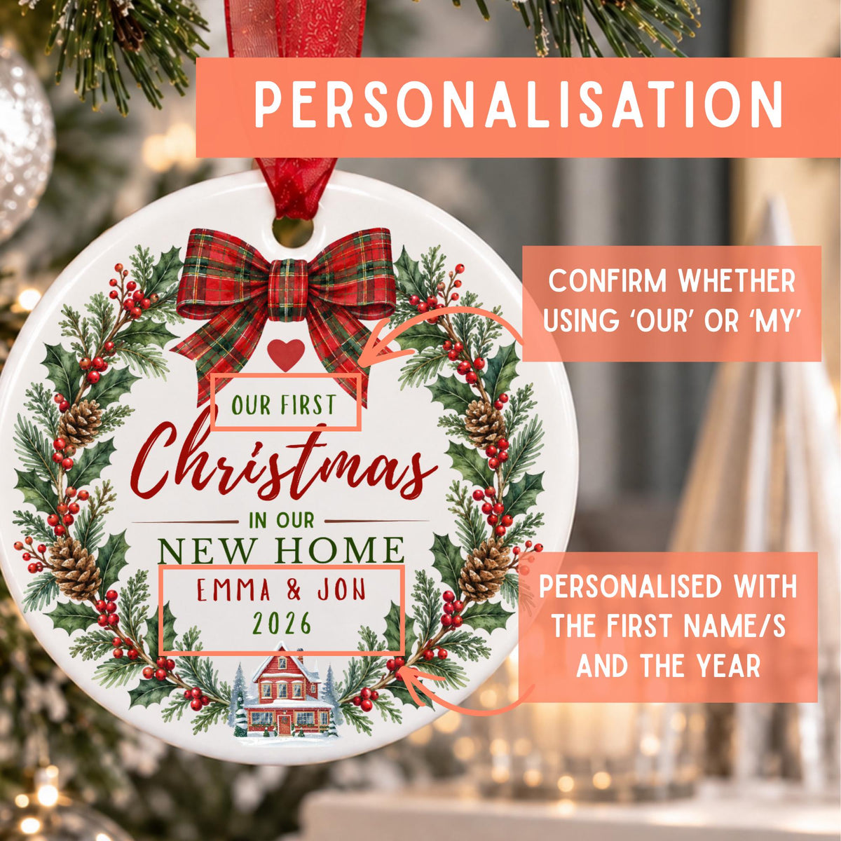 Personalized round Christmas ornament with a red ribbon hanger, featuring a festive wreath design with pinecones, red berries, and a red plaid bow. The ornament includes customizable text reading 'Our First Christmas in our New Home Emma & Jon 2026' with a small house illustration at the bottom.
