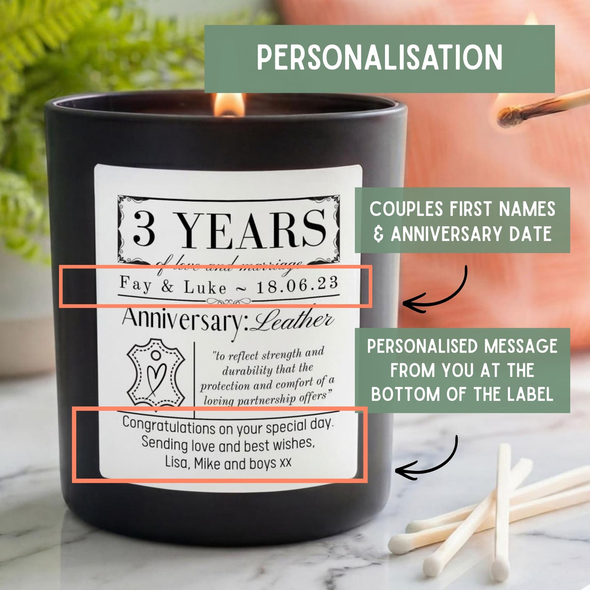 A black candle with a white personalized label reading '3 Years Anniversary: Leather' and a small flame visible at the top. Green text boxes explain personalization details, with matchsticks on a marble surface in the foreground.