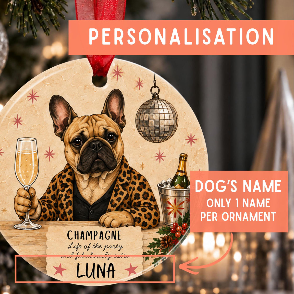 Personalized Christmas ornament featuring a French bulldog in a leopard-print jacket holding a champagne glass, with text fields for dog's name and a custom quote, shown on a festive blurred background.