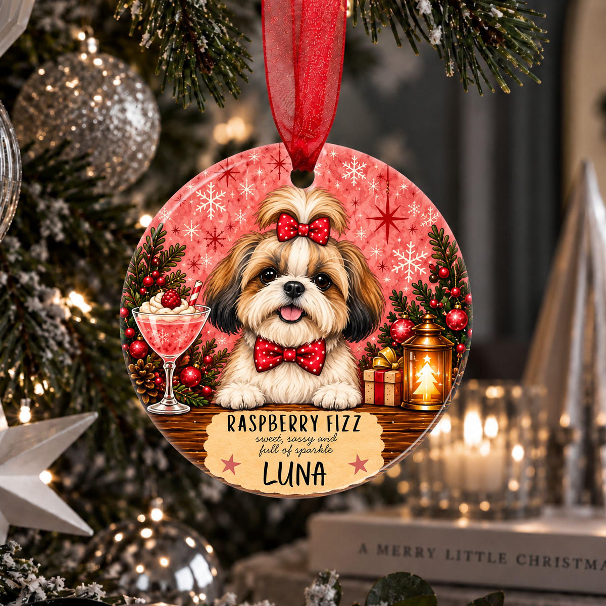 A personalized round Christmas ornament hanging on a decorated tree. The ornament features a printed illustration of a Shih Tzu dog wearing a red bow and bow tie, with the text 'RASPBERRY FIZZ comes with a full of sparkle LUNA'.