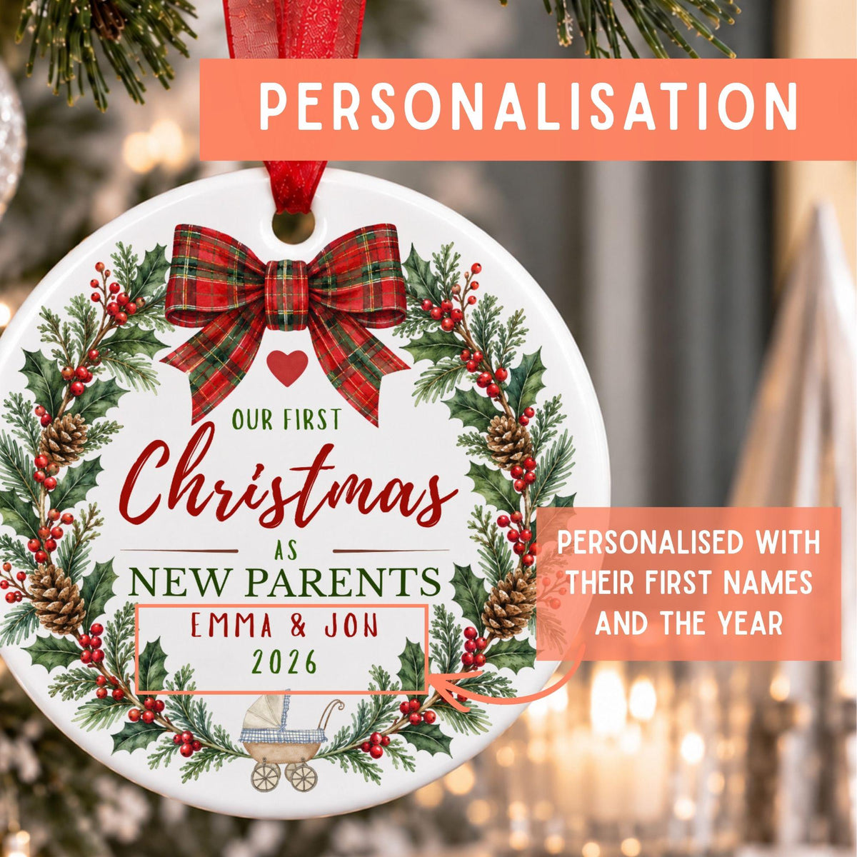 a ceramic bauble with a new parent personalised design. Big text showcasing where the ornament can be personalised with their first names and the year.
